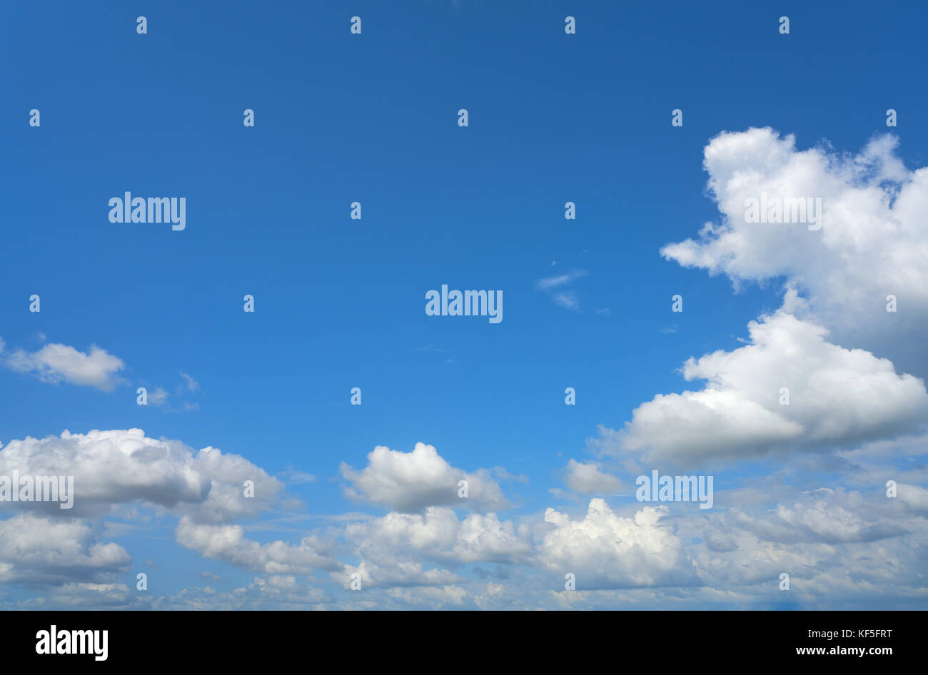Blue summer sky white cumulus clouds background Stock Photo - Alamy