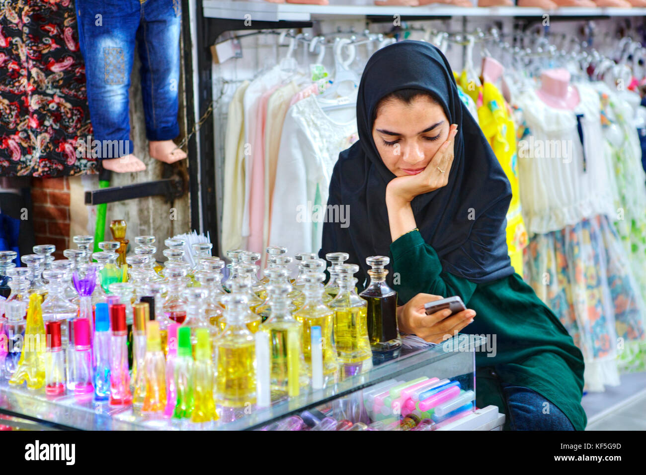 Shiraz, Iran - 19 april, 2017:  Iranian Muslim woman sells toilet water. Stock Photo