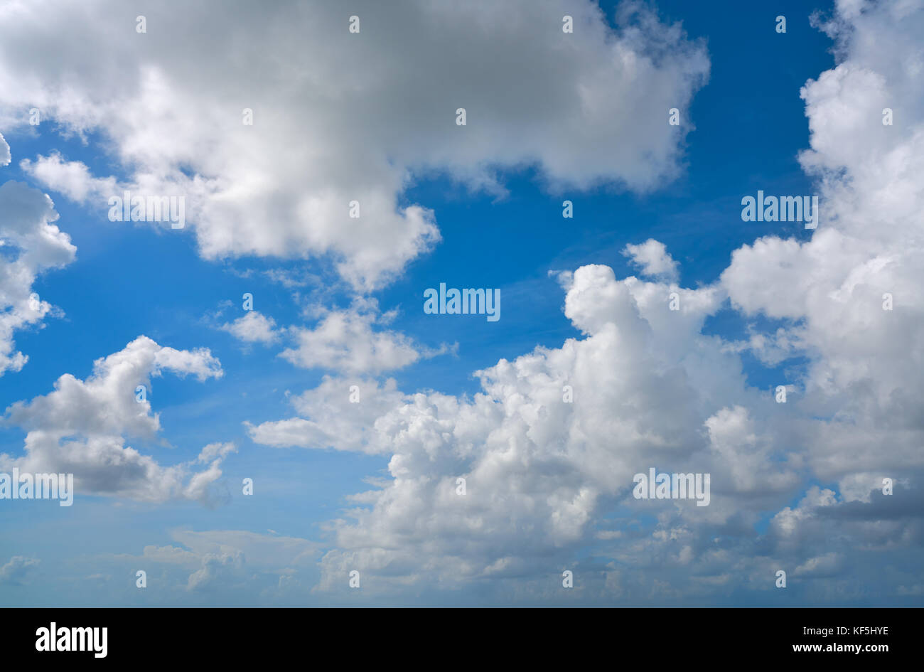 Blue summer sky white cumulus clouds background Stock Photo - Alamy