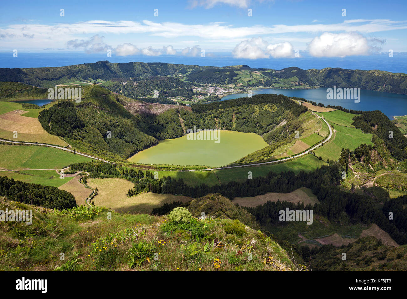 View into the volcanic crater Caldera Sete Cidades, in front of the crater lake Lagoa de Santiago, in the back right crater Stock Photo