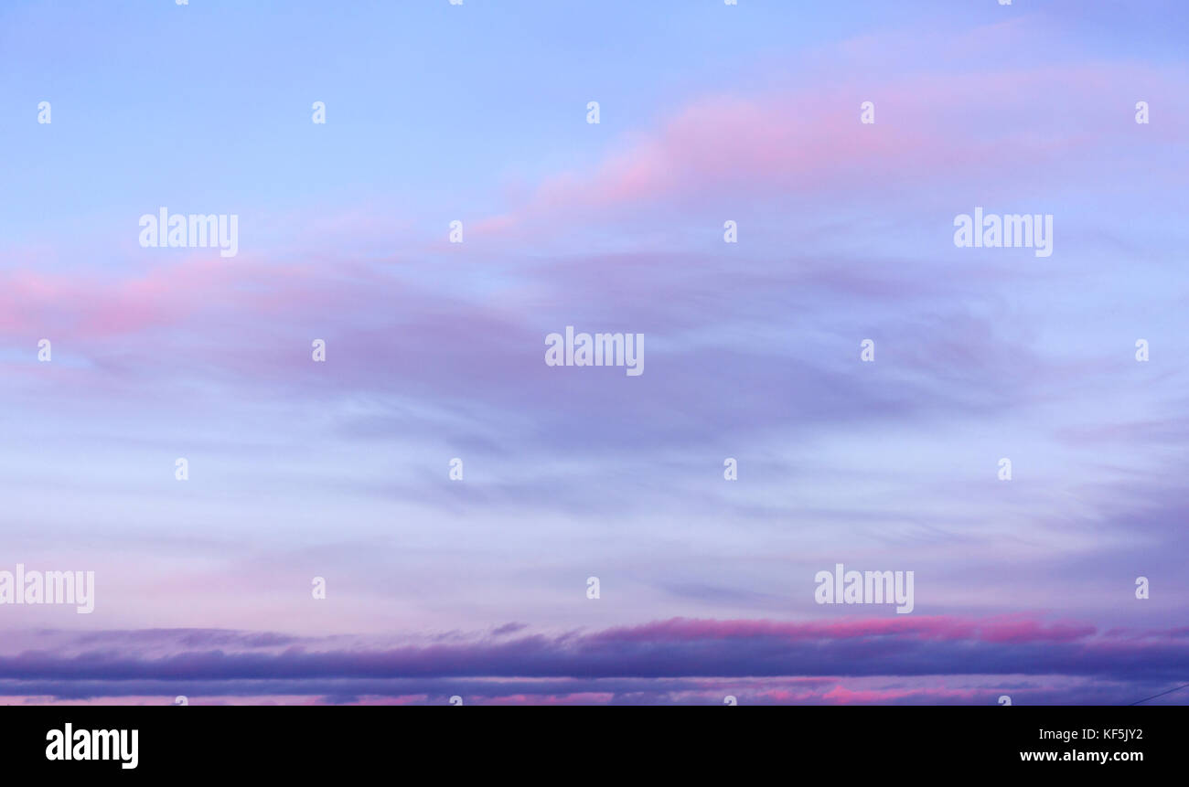 Blue sky background with purple and pink clouds Stock Photo - Alamy