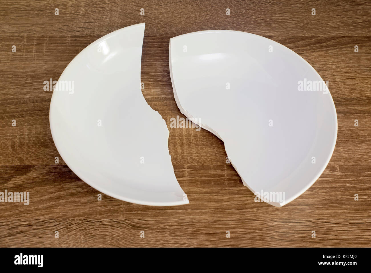 White broken plate on the table Stock Photo 164239096 Alamy