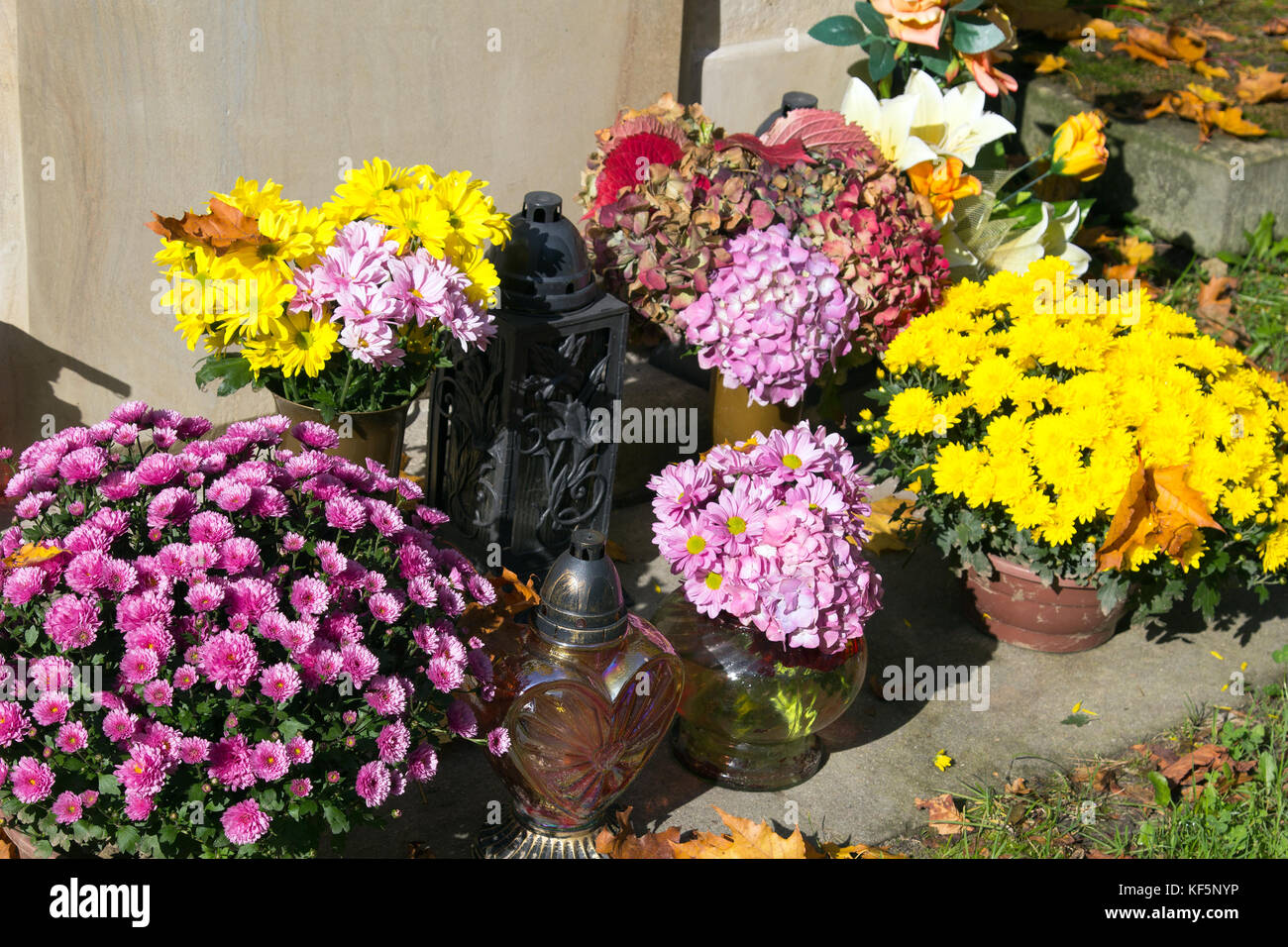 Graves Decorations Chrysanthemum Flowers And Votive Candles All