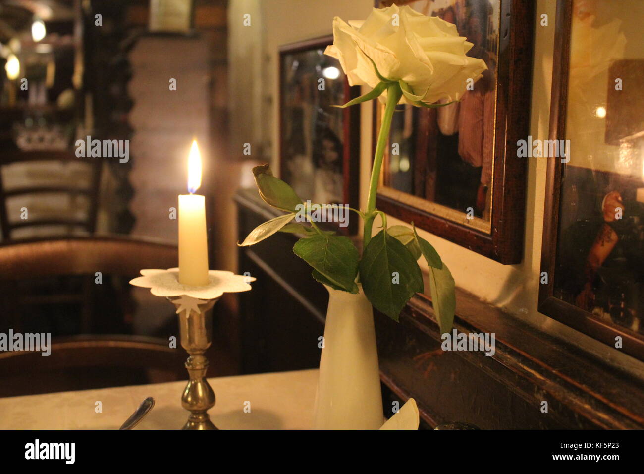A romantic candlelight dinner in an italian restaurant Stock Photo
