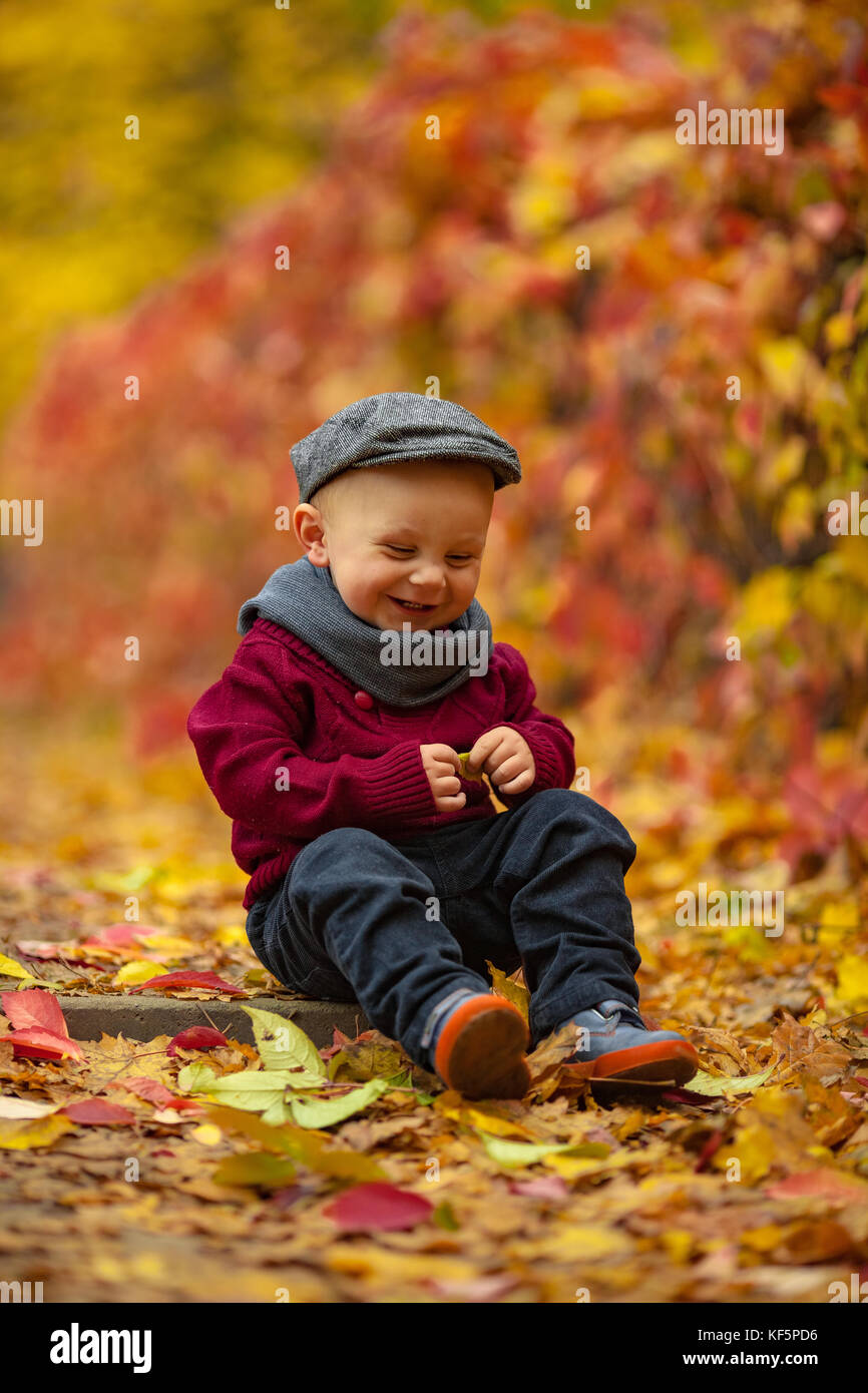 Little smiling child boy wearing hat 