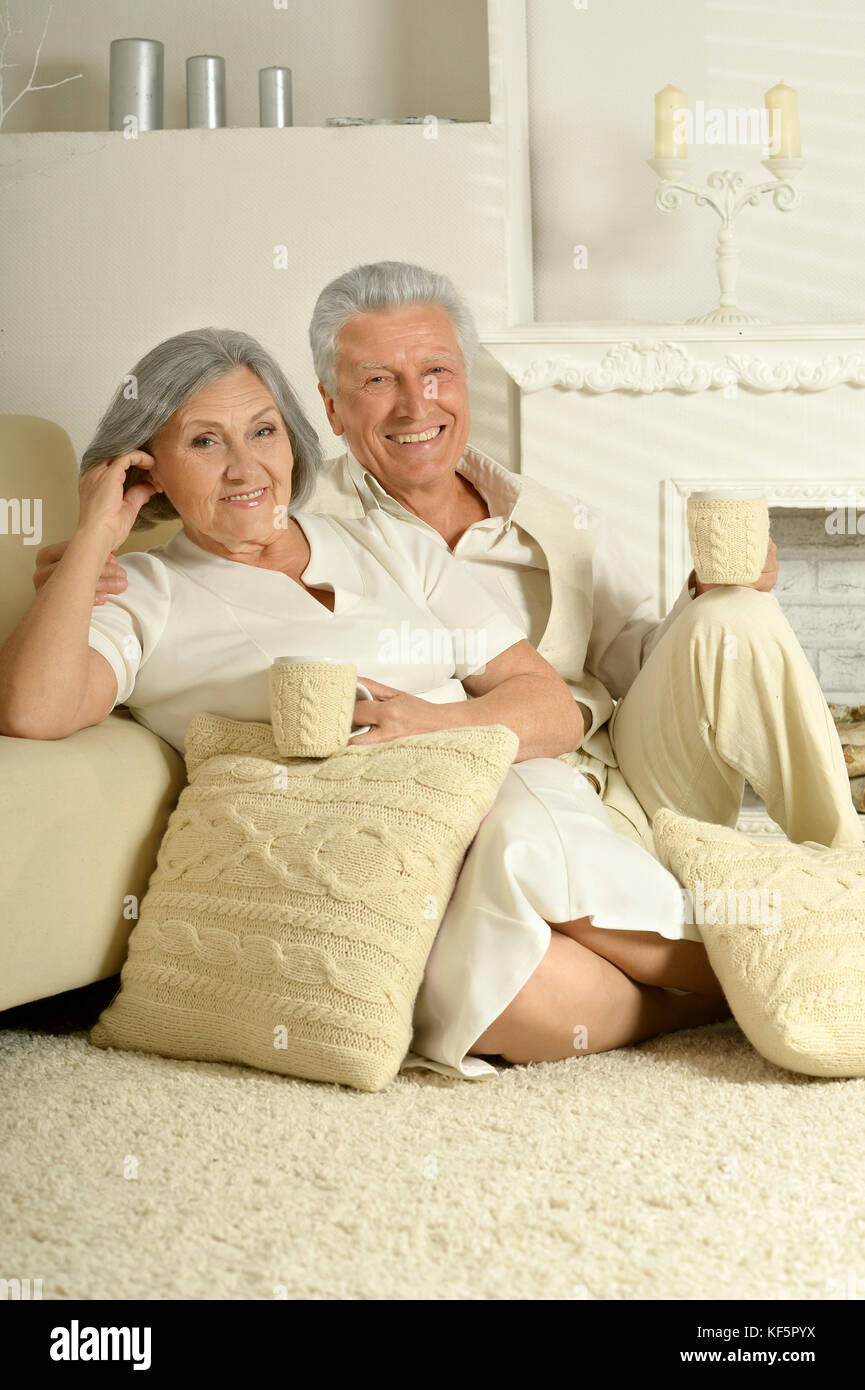 Elderly people sitting at home Stock Photo