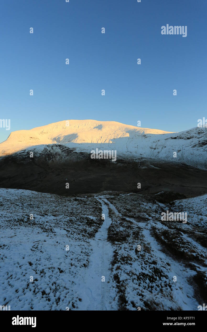 Tromsdalstind Covered In Snow In Autumn Sun Stock Photo
