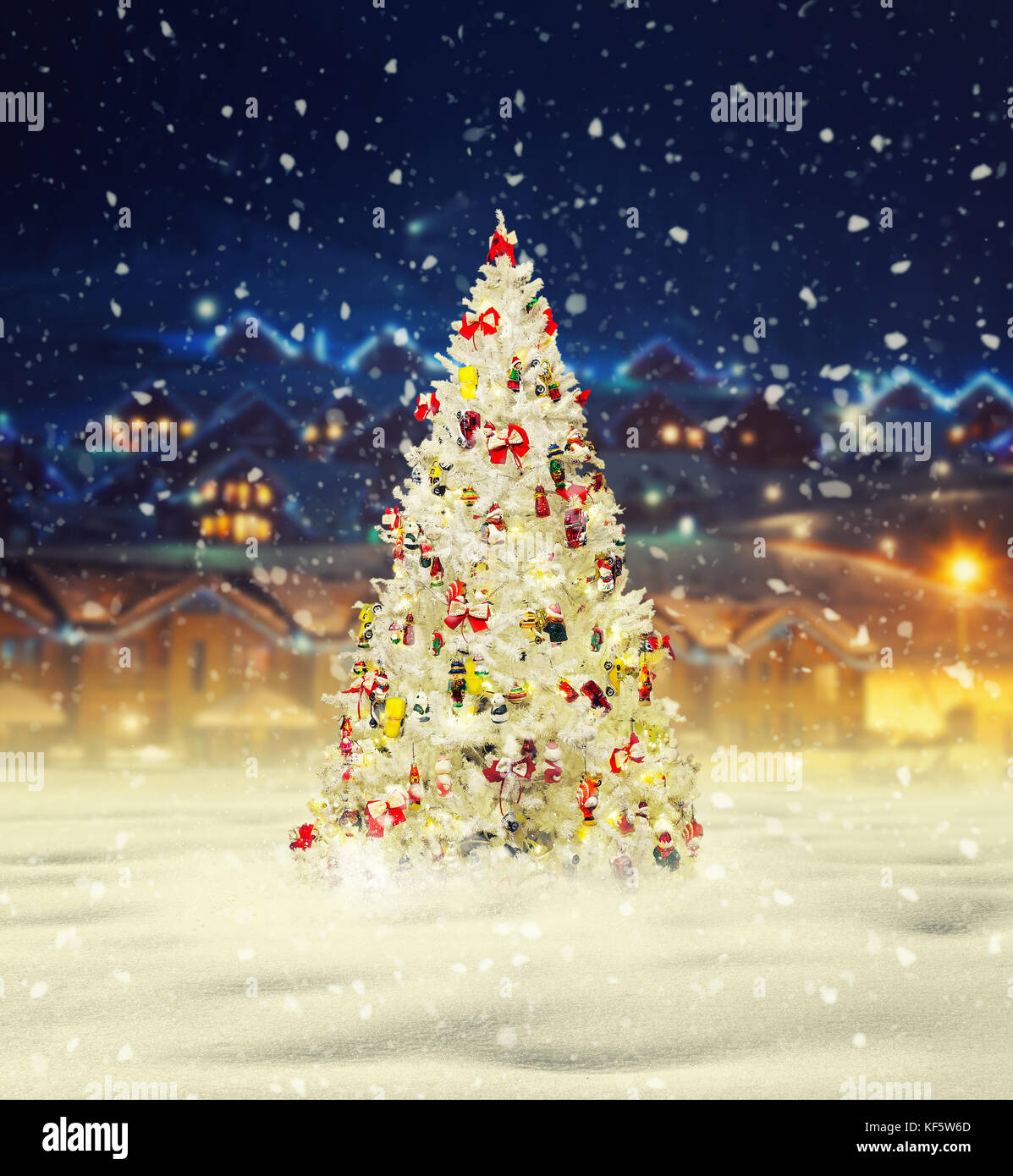 Merry christmas, snowy xmas tree with decoration Stock Photo