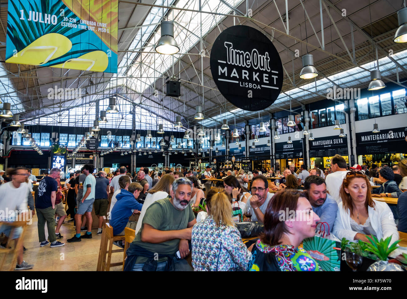 Lisbon Portugal,Cais do Sodre,Mercado Da Ribeira,Time Out Market,market hall,food court plaza,dining,tables,crowded,busy,Hispanic man men male,woman f Stock Photo