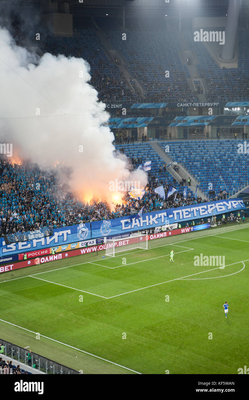 SAINT-PETERSBURG, RUSSIA-OKT 21, 2017: Fire and smoke from burning missile are on Zenit fans terrace sector. Russian Championship football match betwe Stock Photo