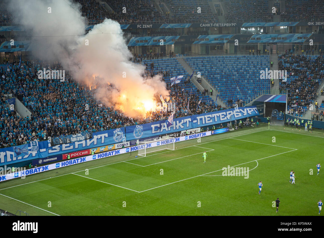 SAINT-PETERSBURG, RUSSIA-OKT 21, 2017: Fire and smoke from missile are on Zenit fans sector. Russian CUP football match between Zenit and Dinamo Saint Stock Photo