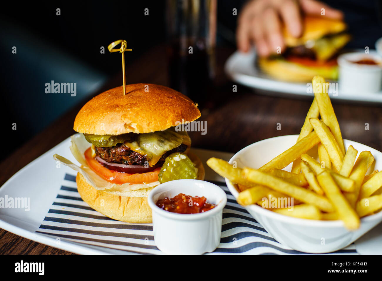 British Beef Burger with chips and coke Stock Photo Alamy