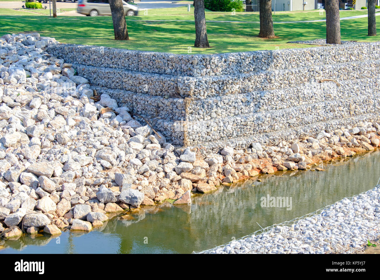 Reinforced drainage canal with rock reinforcement providing rain runoff control in Oklahoma City, Oklahoma, USA. Stock Photo