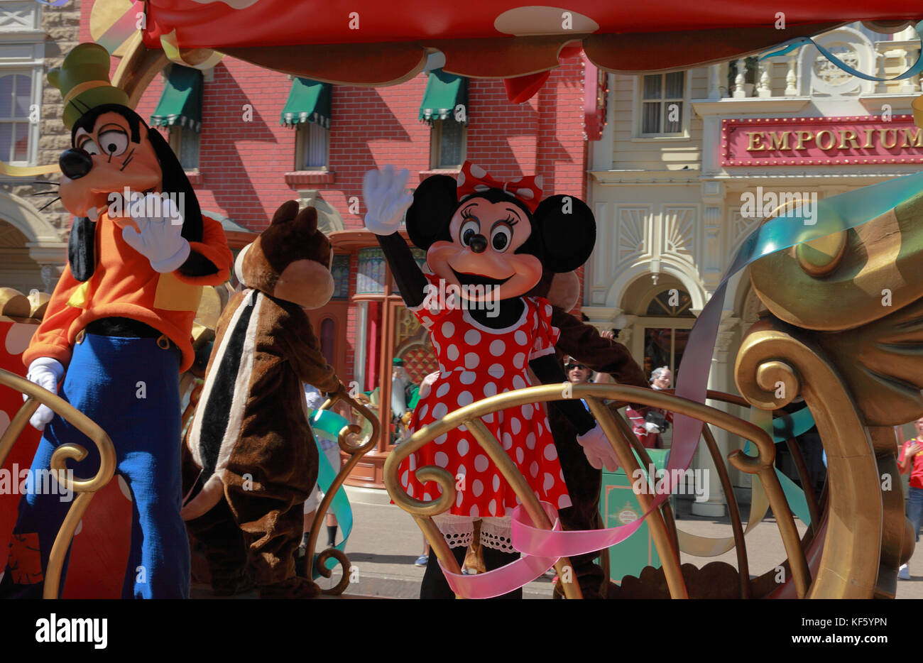 Paris,France,July,11th 2010: Goofy and Minnie Mouse waving to the fans while passing by them in the 'All Stars Express'.This is a car express full of  Stock Photo