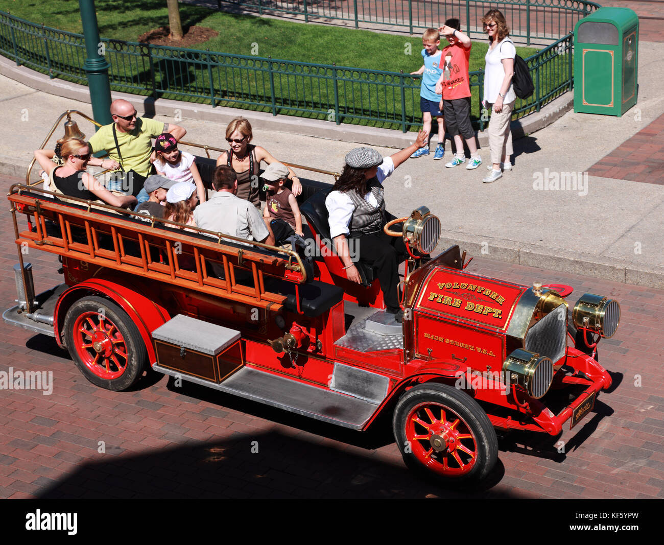 paris-france-july-11th-2010-upper-view-of-an-old-fashion-fire-department-car-transporting-a-group-of-tourists-in-the-streets-of-disneyland-park-in-pa-stock-photo-alamy