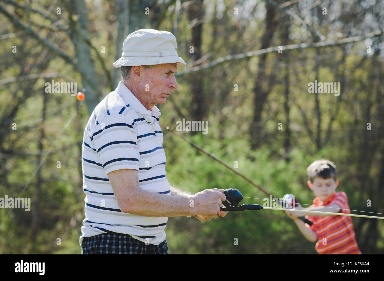 A grandfather and grandson fishing Stock Photo