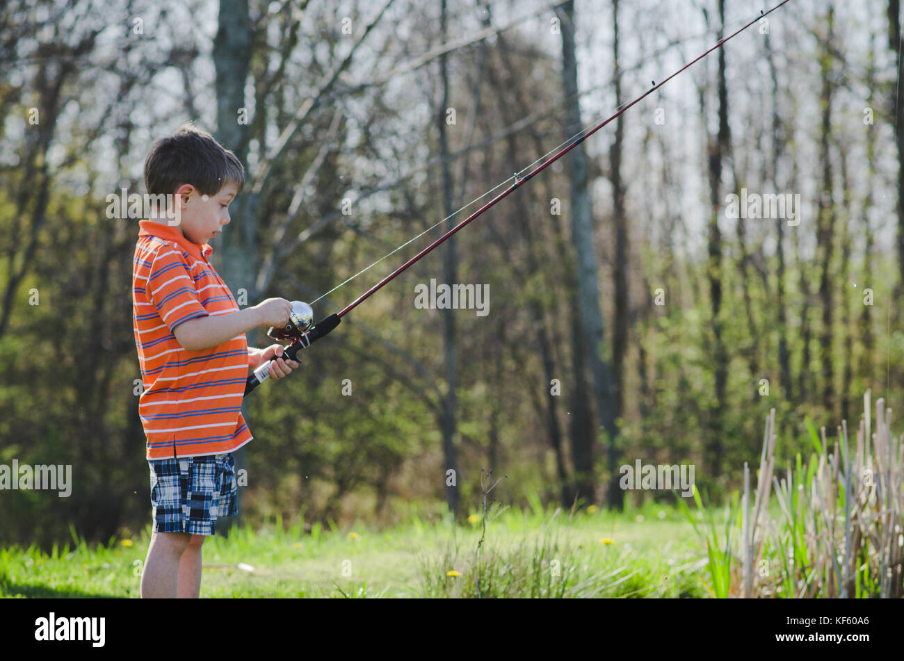 5-6 year old boy fishing by a pond in summer Stock Photo - Alamy 5-6 year old boy fishing by a pond in summer Stock Photo - Alamy