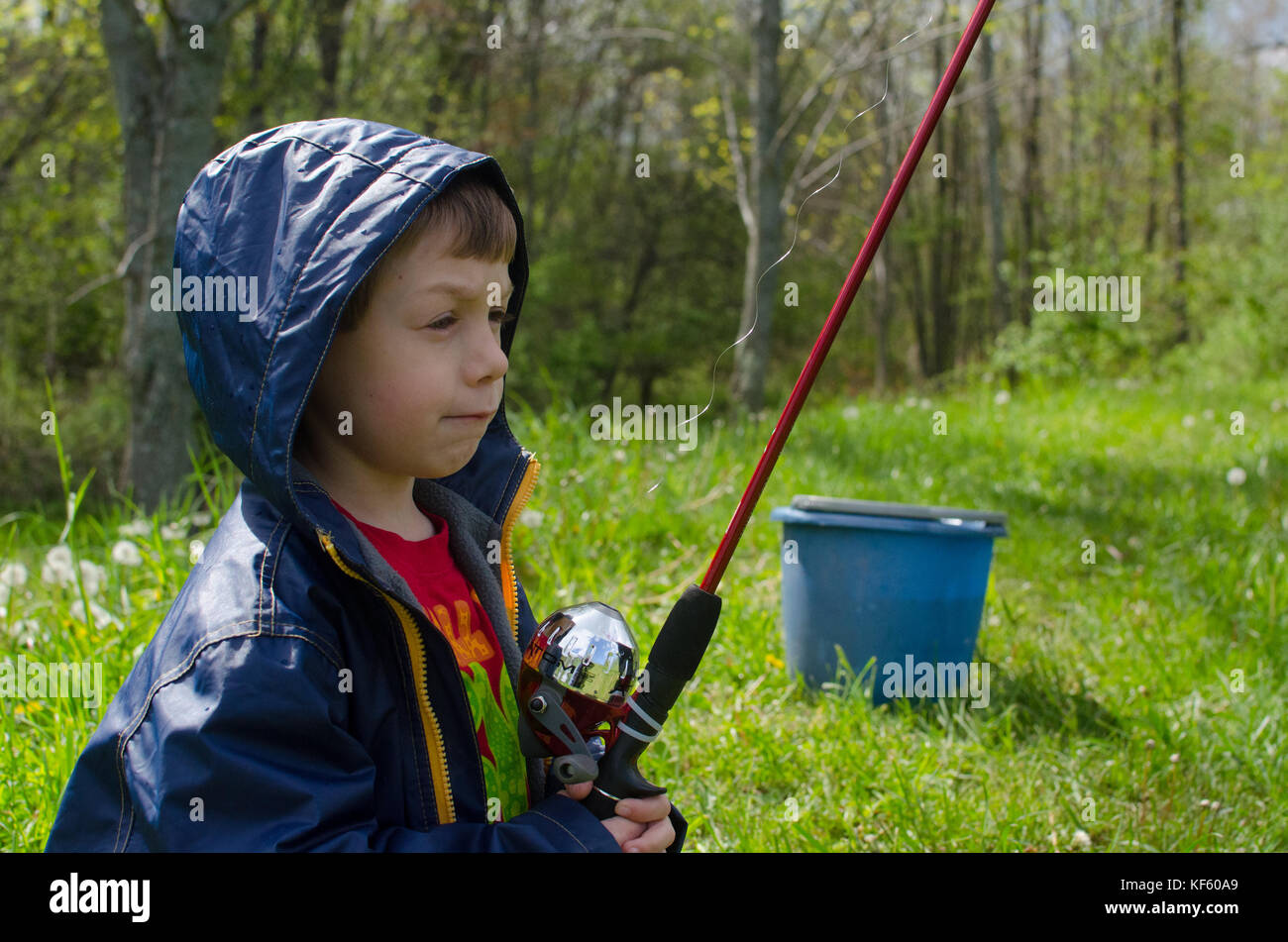 5-6 year old boy fishing by a pond in summer Stock Photo - Alamy