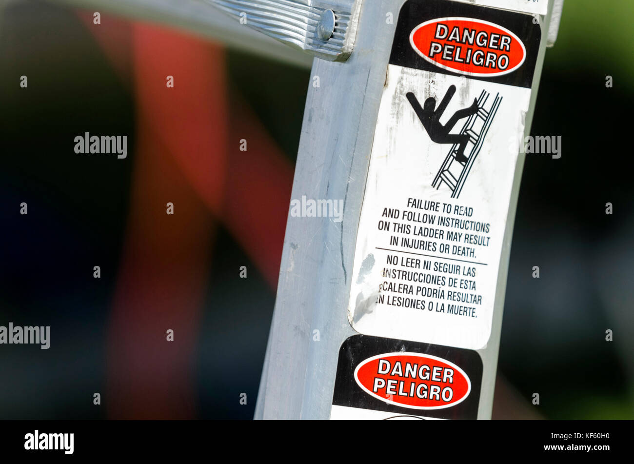 Warning label on side of aluminum ladder indicating danger when used improperly Stock Photo