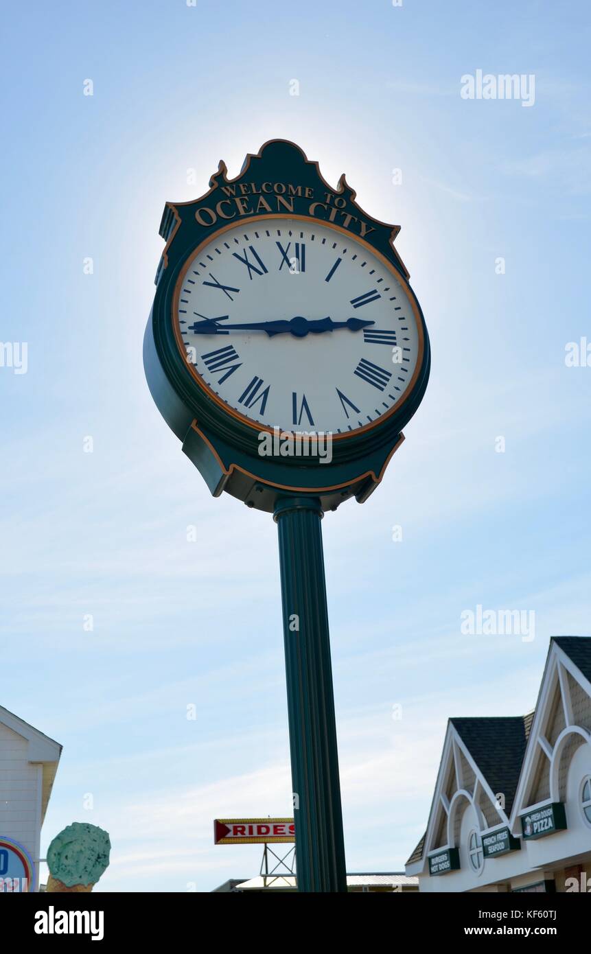 Clock with Flags in Wind at Ocean City Stock Photo