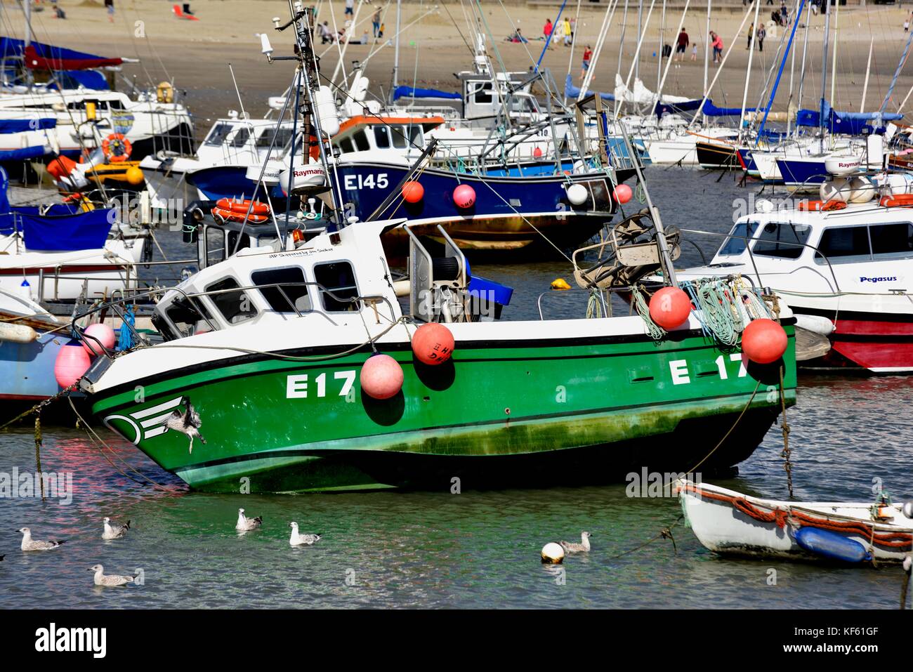 Fishing boats at low tide Lyme Regis Dorset England UK Stock Photo Alamy
