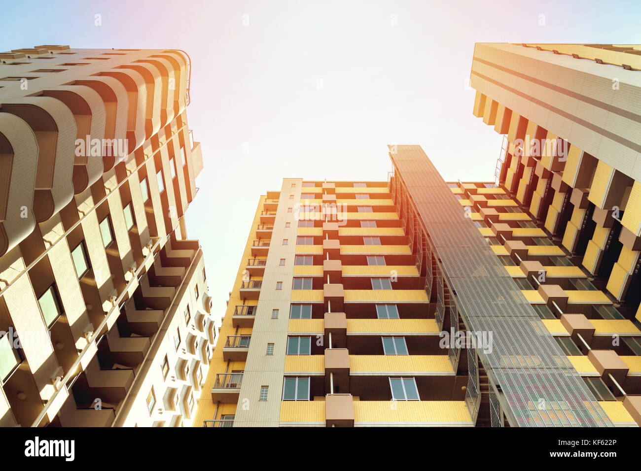 low angle view of the common modern condominium building with skyscrapers in afternoon, concept of economics, construction, modern city life, accommod Stock Photo