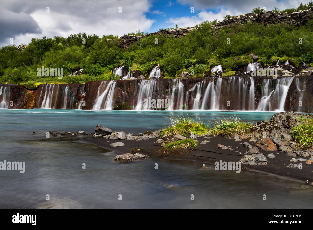 Hraunfossar or Lava Falls, near Husafell Iceland. These beautiful falls come from underneath the nearby lava field near Husafell Stock Photo