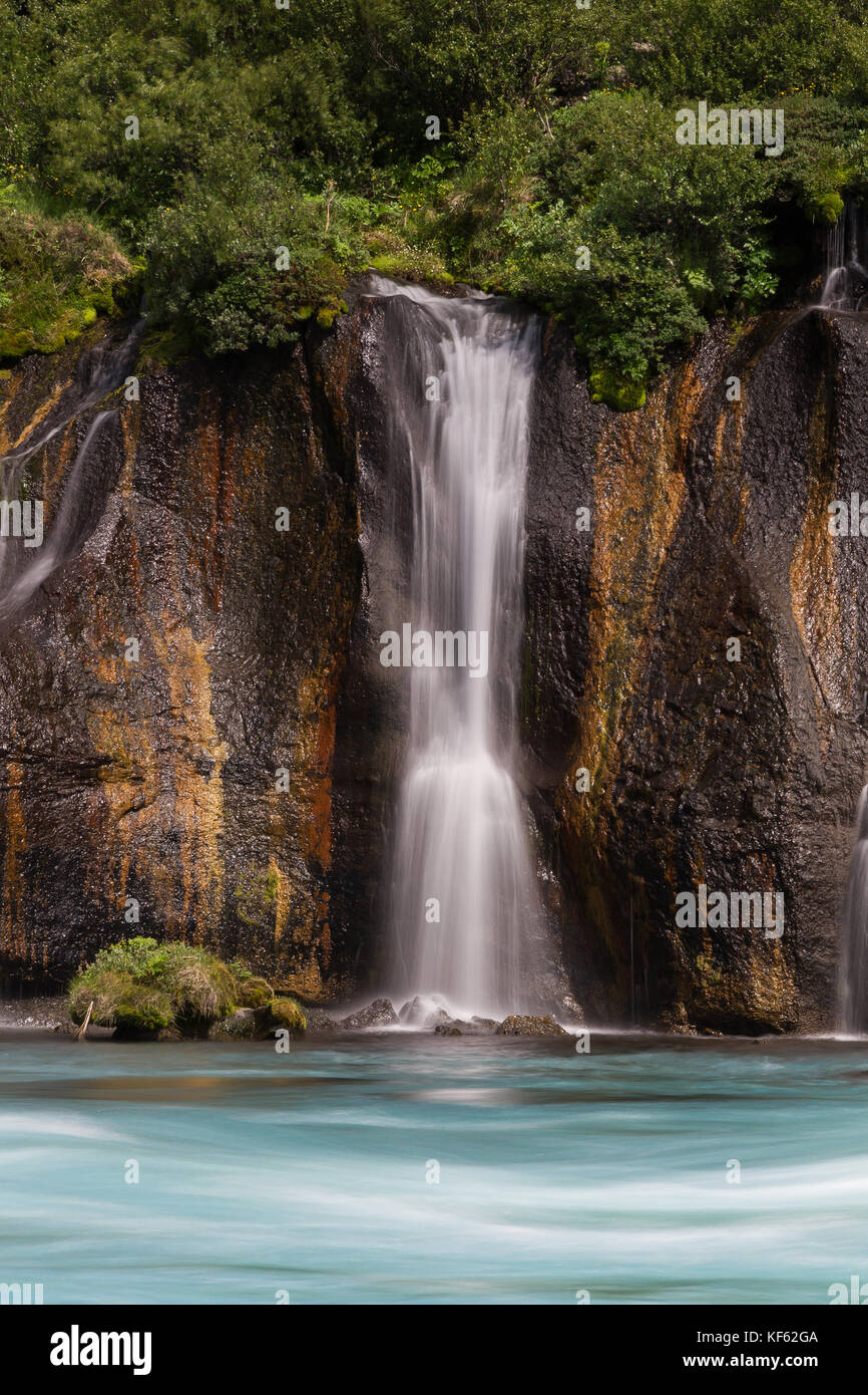 Hraunfossar or Lava Falls, near Husafell Iceland. These beautiful falls come from underneath the nearby lava field near Husafell Stock Photo