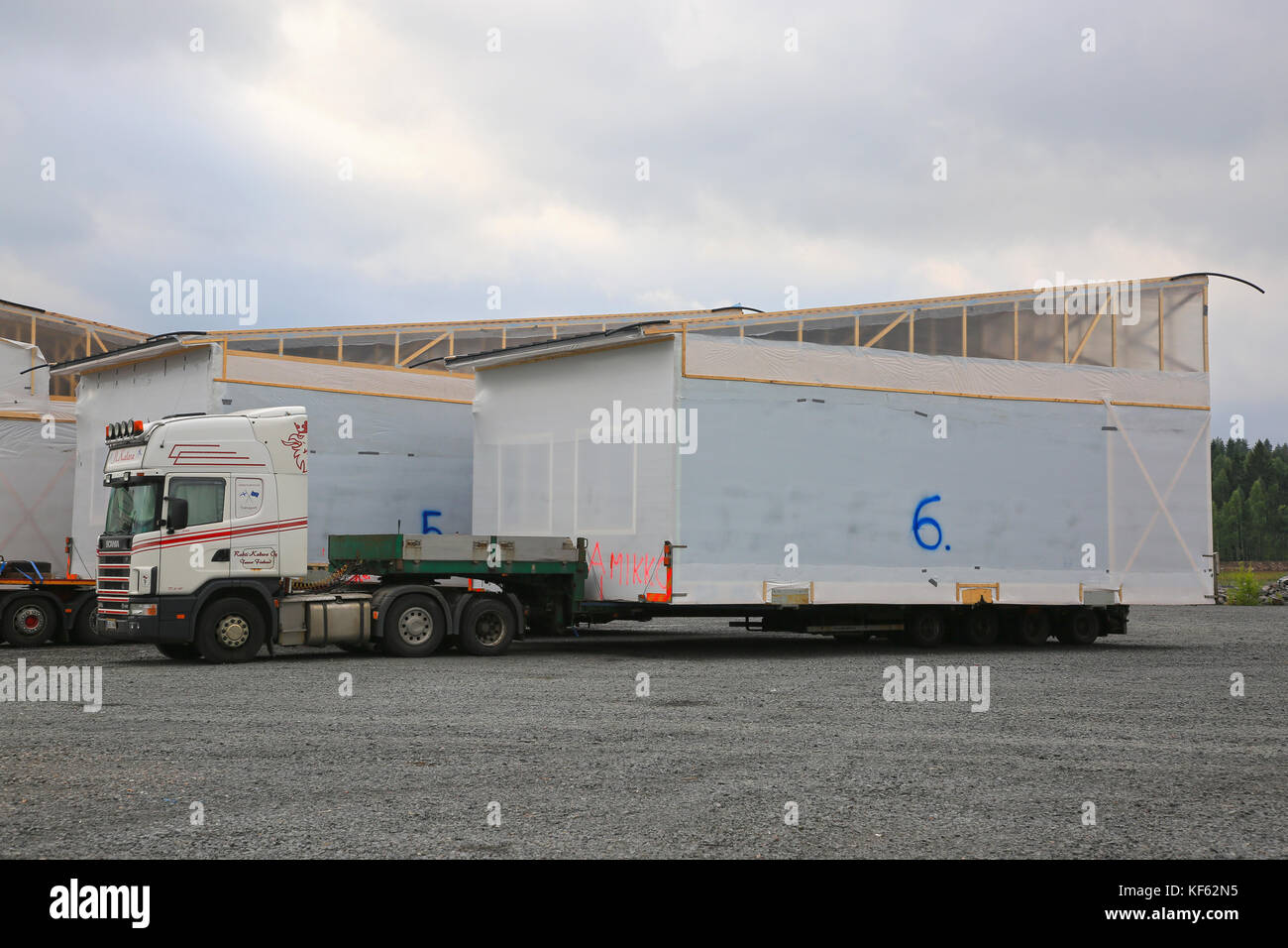 FORSSA, FINLAND - AUGUST 10, 2017: Scania 164L semi trailer of Rahti-Kaleva Oy is to transpory a prefabricated house module as oversize load in South  Stock Photo