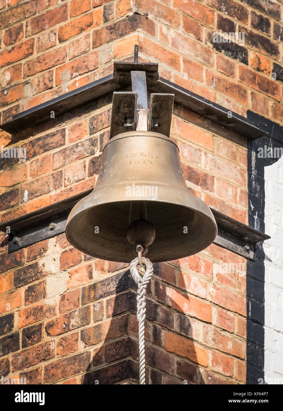 The Atlas Bell, Gloucester Docks. The bell of the Atlas ship, launched in 1812. Later in 1832 it signalled the dockers starting and finishing times. Stock Photo