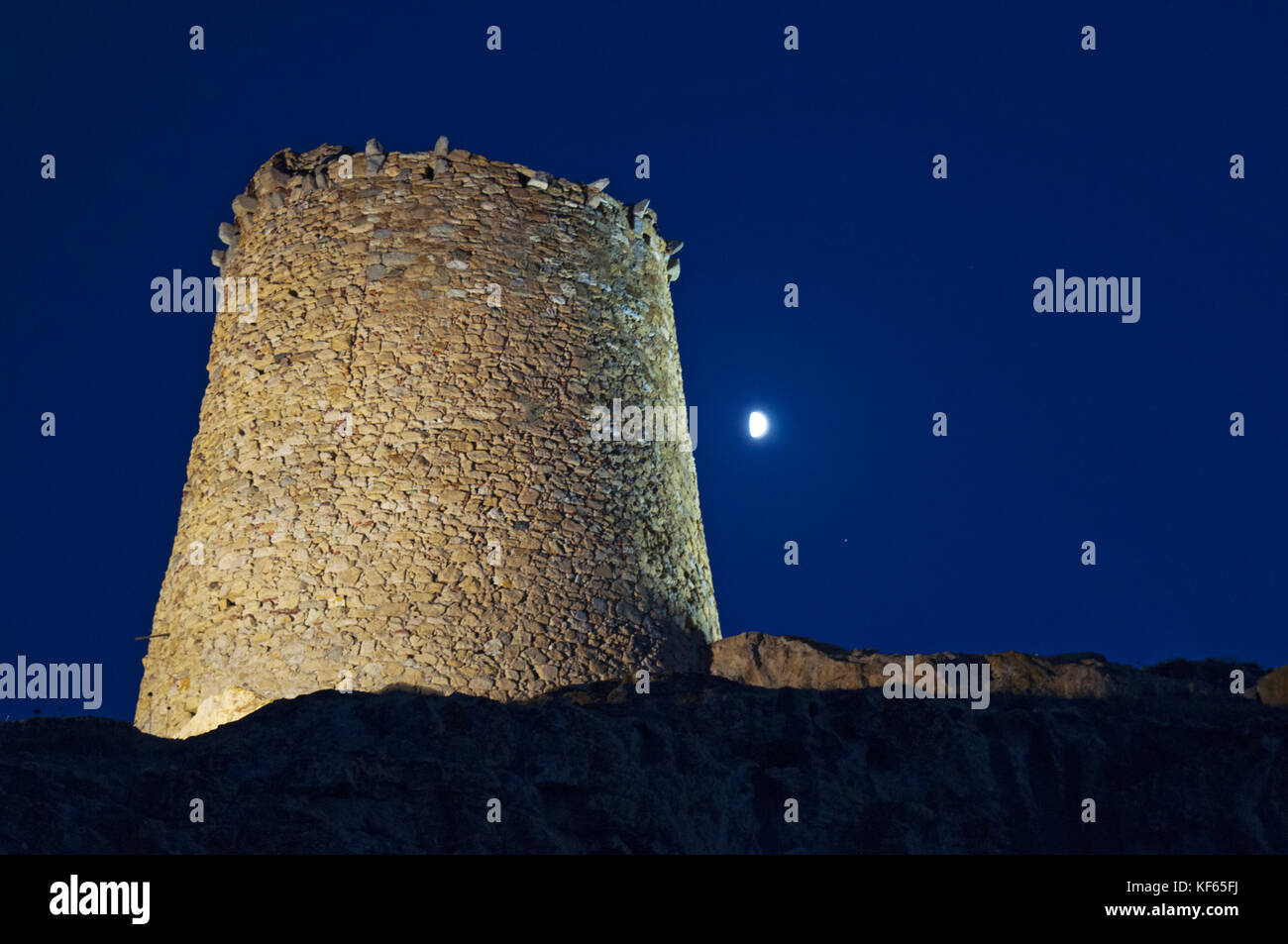 Corsica: moonlight on the Genoese Tower (15th century) on the top of the Ile de la Pietra (Stone Island), rocky promontory of Ile-Rousse (Red Island) Stock Photo