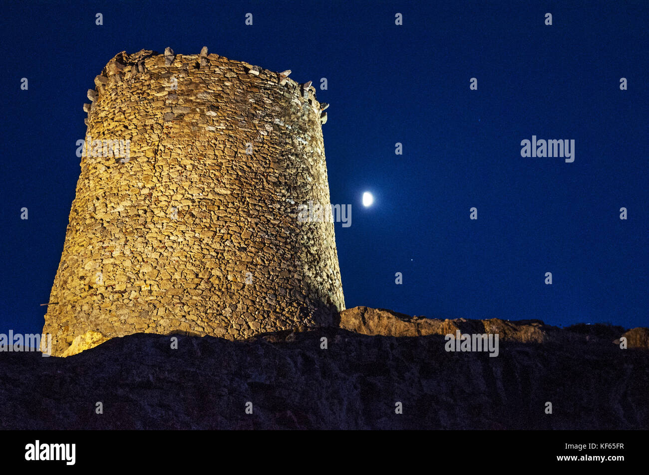 Corsica: moonlight on the Genoese Tower (15th century) on the top of the Ile de la Pietra (Stone Island), rocky promontory of Ile-Rousse (Red Island) Stock Photo