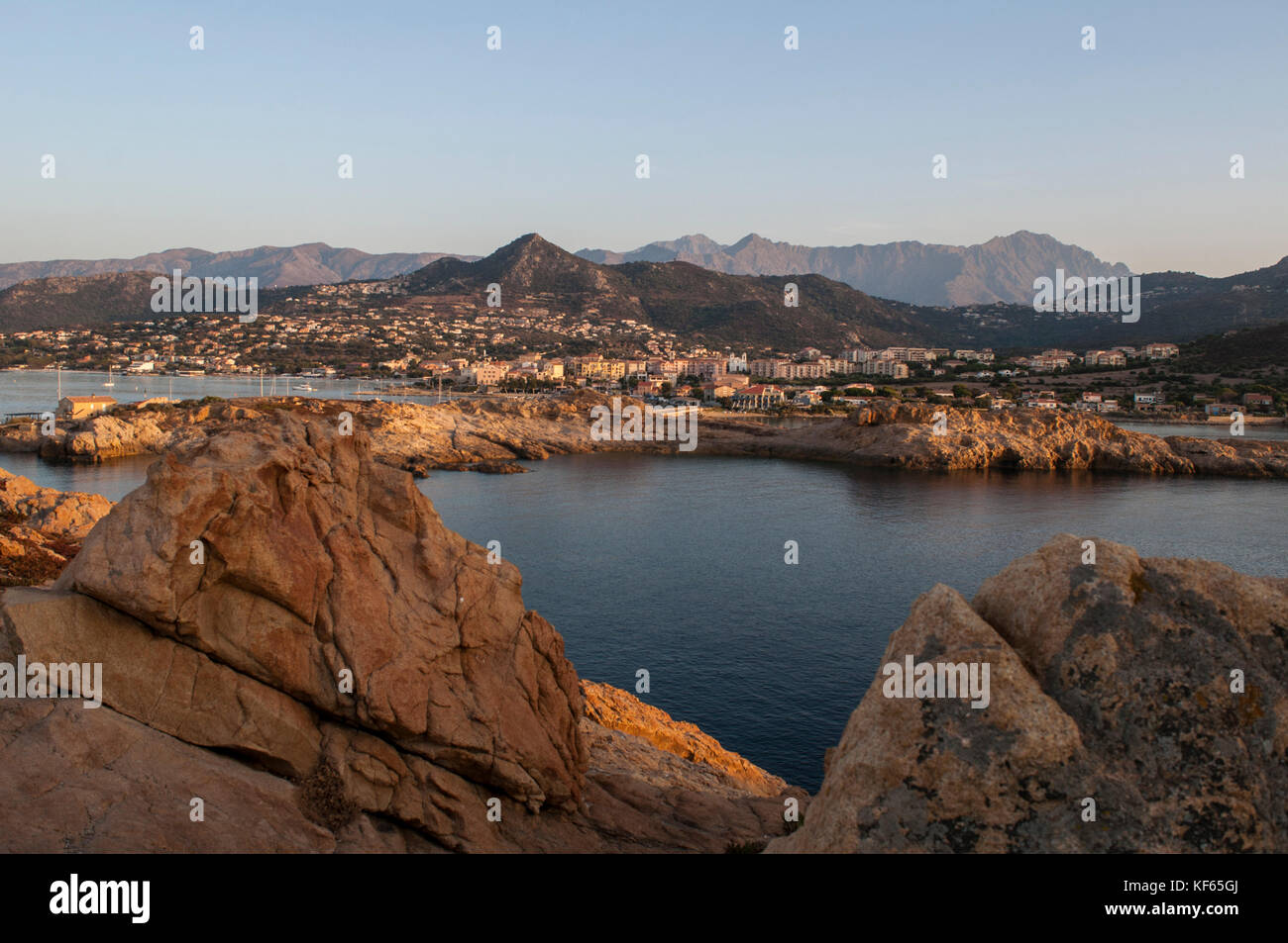 Corsica: sunset and the skyline of Ile-Rousse (Red Island), the famous city of the Upper Corsica, with view of the port and the boats Stock Photo