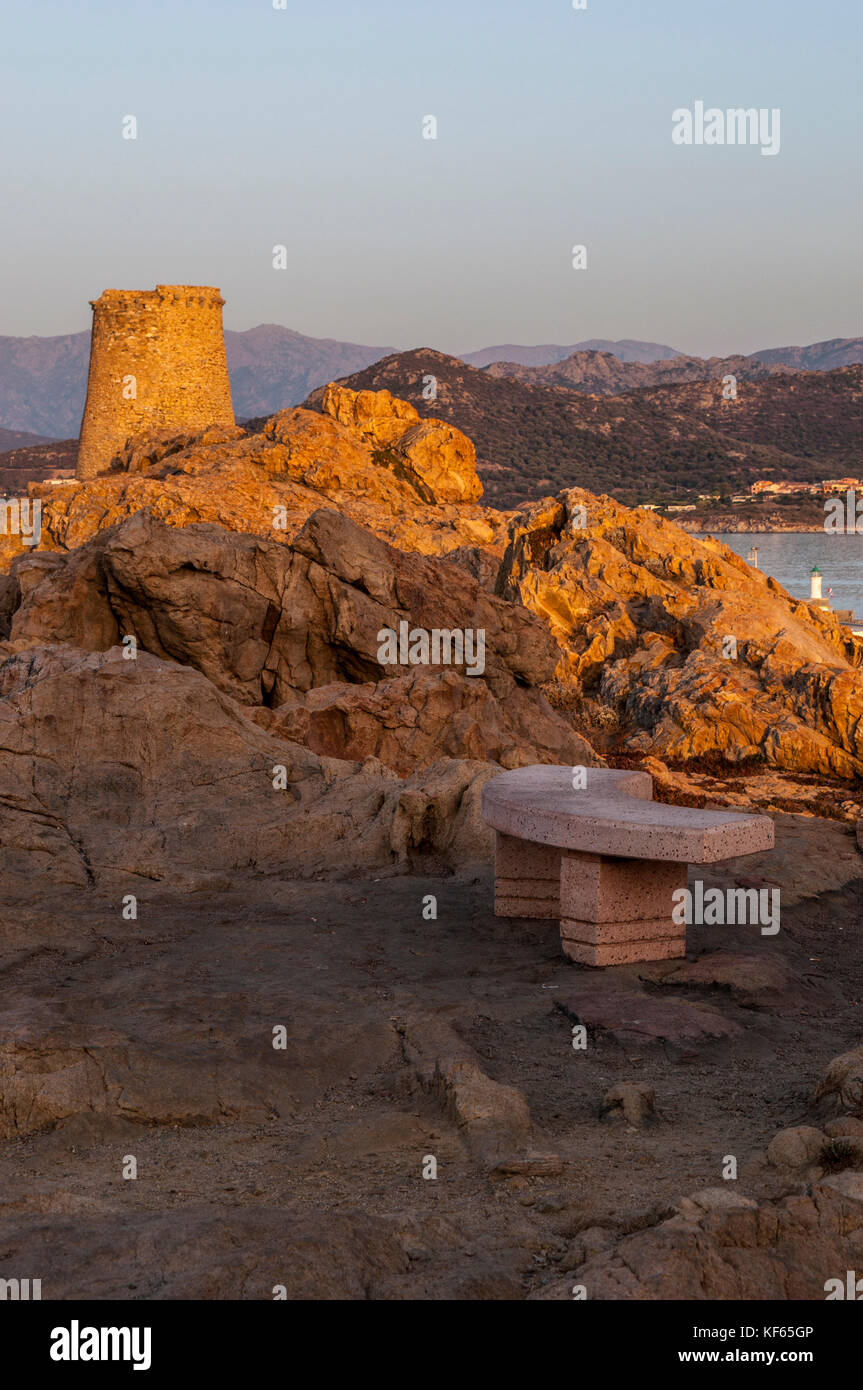 Corsica: sunset and skyline of Ile-Rousse (Red Island) seen from the top of the Ile de la Pietra (Stone Island) with view of the ruined Genoese Tower Stock Photo
