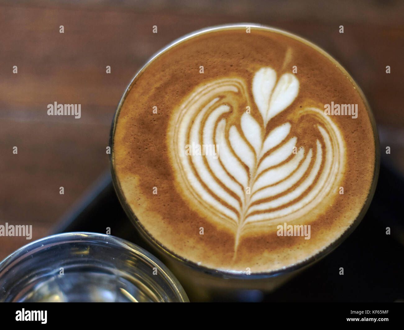 looking down on a decorative foam expresso coffee drink in a cup Stock  Photo - Alamy
