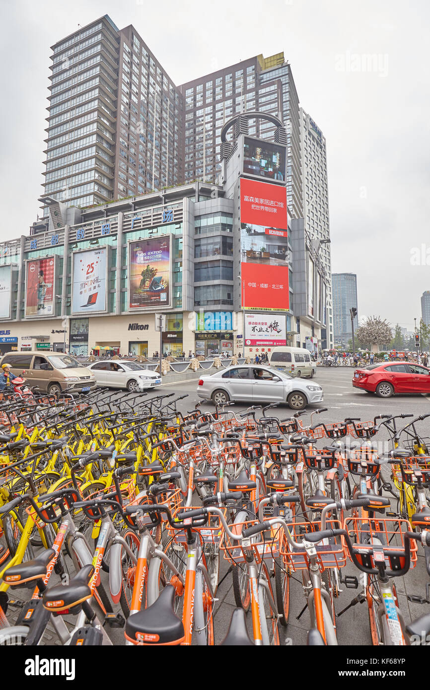 Chengdu, China - September 30, 2017: Public shared bicycles parking in downtown Chengdu. Stock Photo