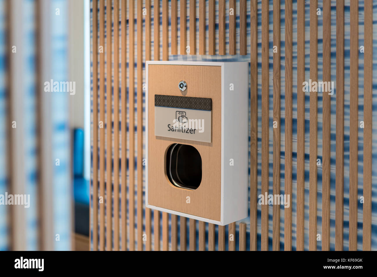 Sanitizer machine outside public bathroom Stock Photo