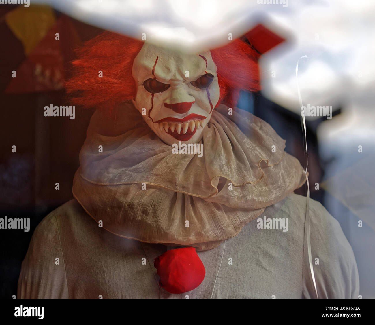scary clown halloween killer red wig dummy craze horror Stock Photo
