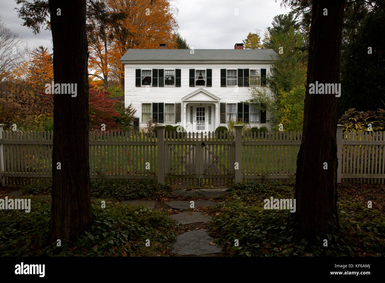New England white clapboard house autumn fall foliage, Lenox, Massachusetts in the Berkshires