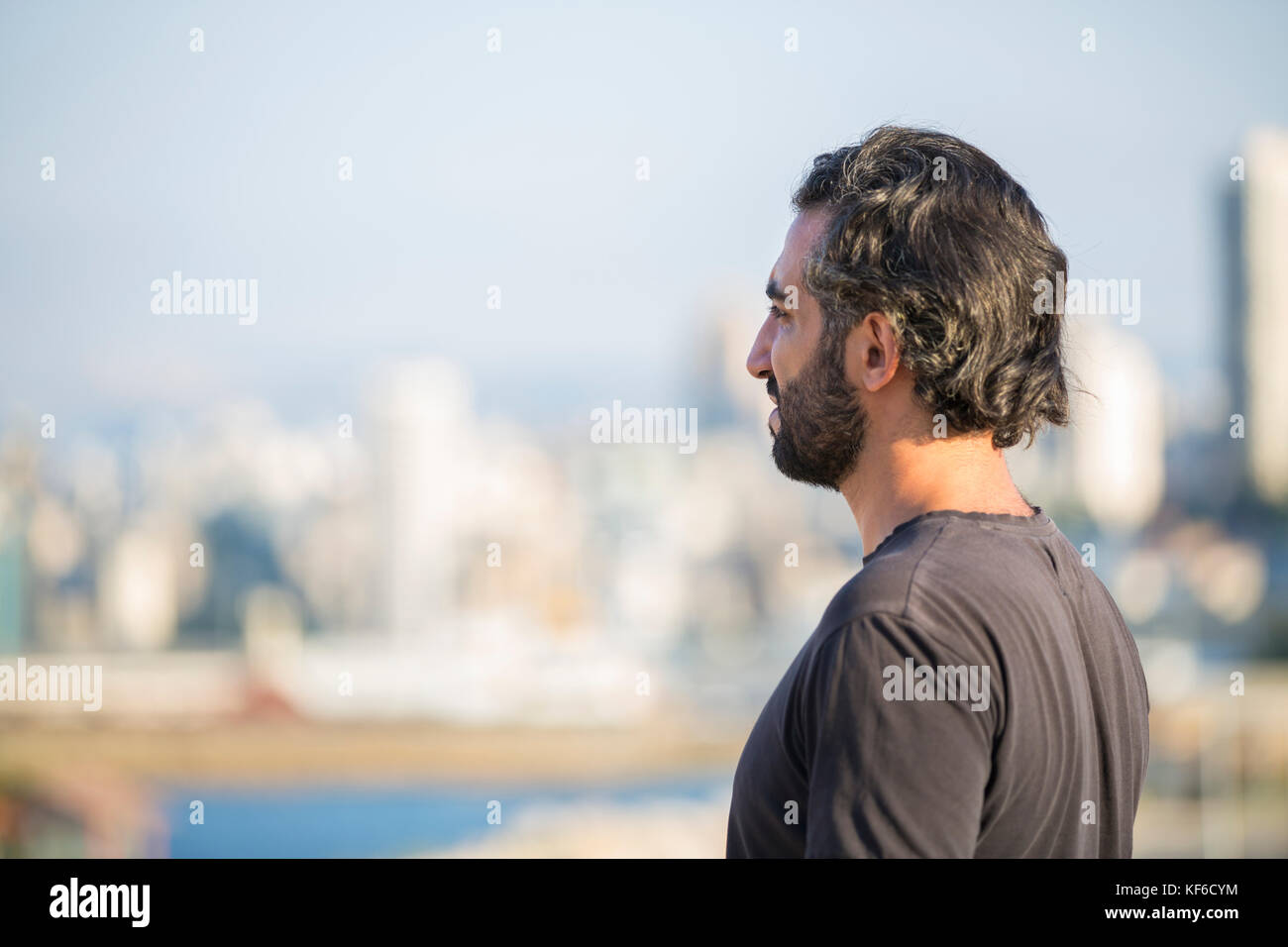 Profile of a bearded man looking away Stock Photo