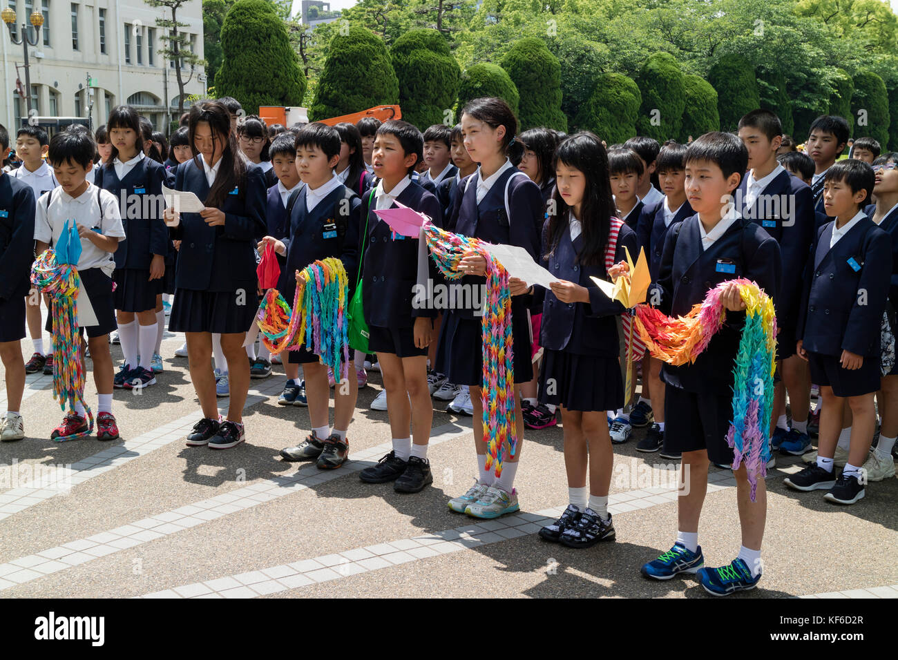 Hiroshima, Japan - May 25, 2017: Students gathering at the Children's Peace Monument to offer thousands colorful origami cranes in memory of atomic bo Stock Photo