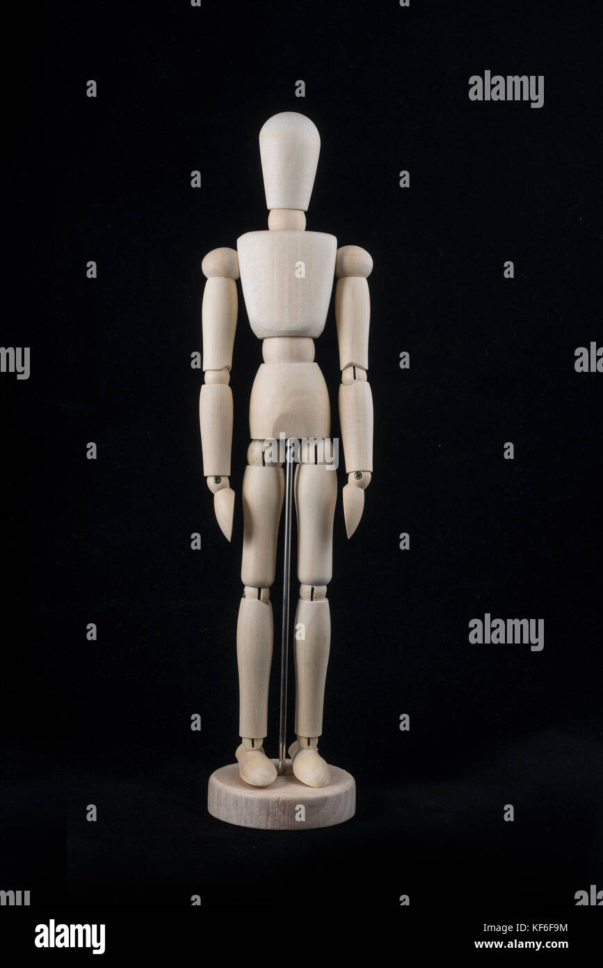 a wooden dummy posing standing Stock Photo Alamy