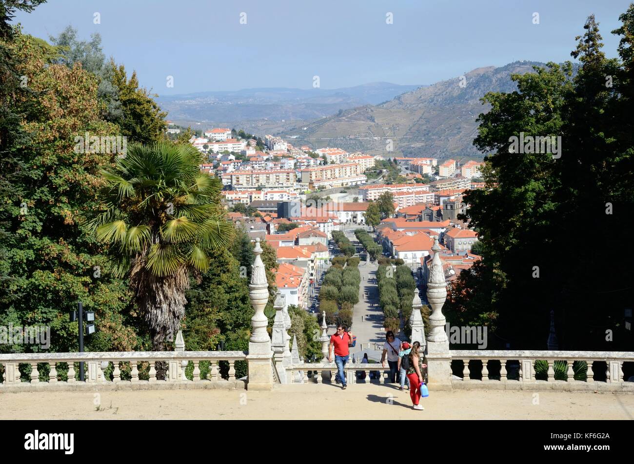 People tourists pilgrims reaching the top of the 686 steps to the church of Our lady of Remedies pilgrim site Lamego Portugal Stock Photo