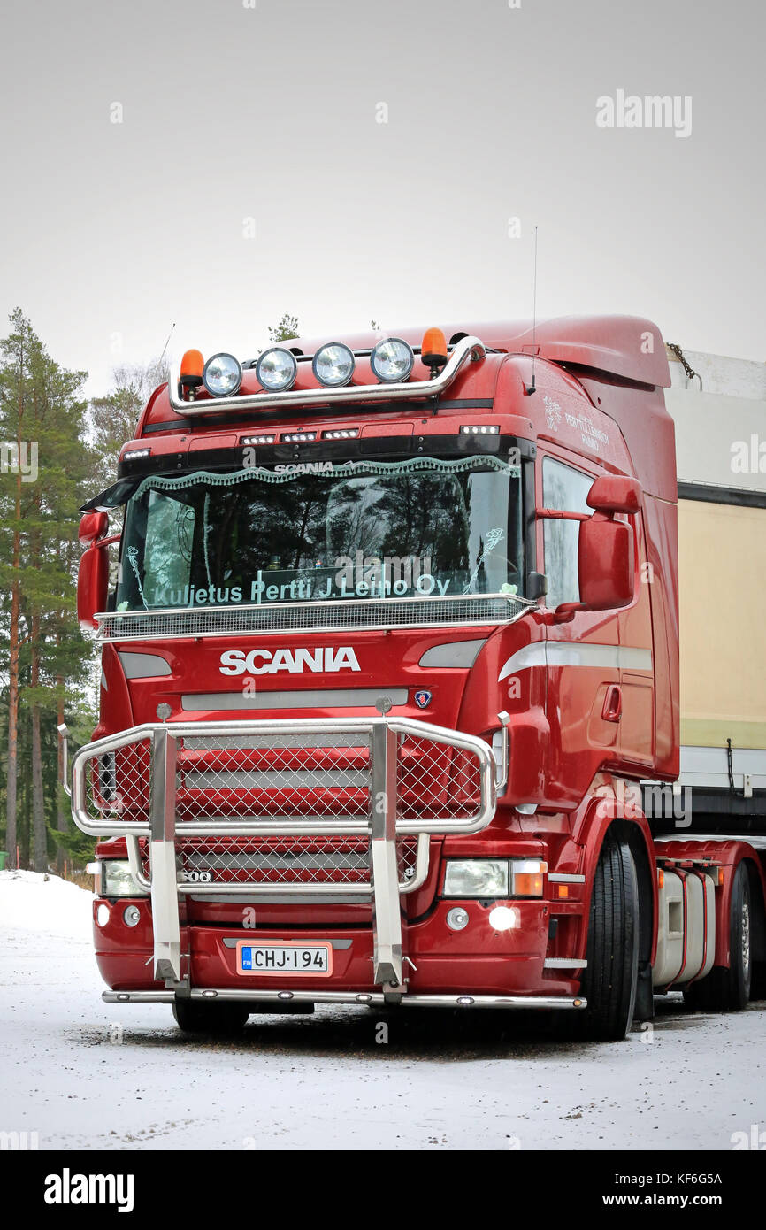 PAIMIO, FINLAND - FEBRUARY 20, 2016: Red Scania R500 truck with bull bar in South of Finland. The truck is ready to go and deliver the load. Stock Photo