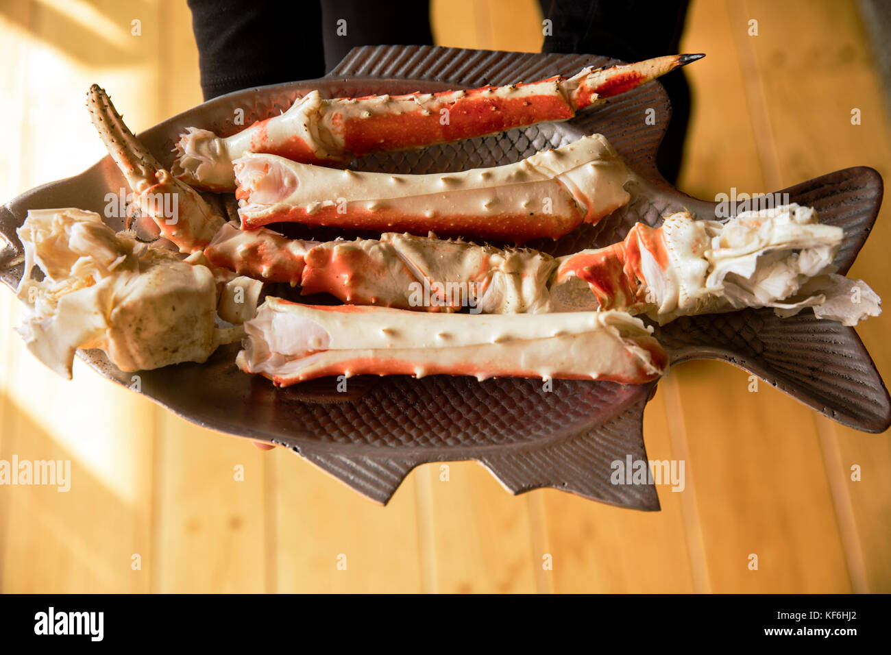 USA, Alaska, Homer, China Poot Bay, Kachemak Bay, King Crab legs being served at the Kachemak Bay Wilderness Lodge Stock Photo
