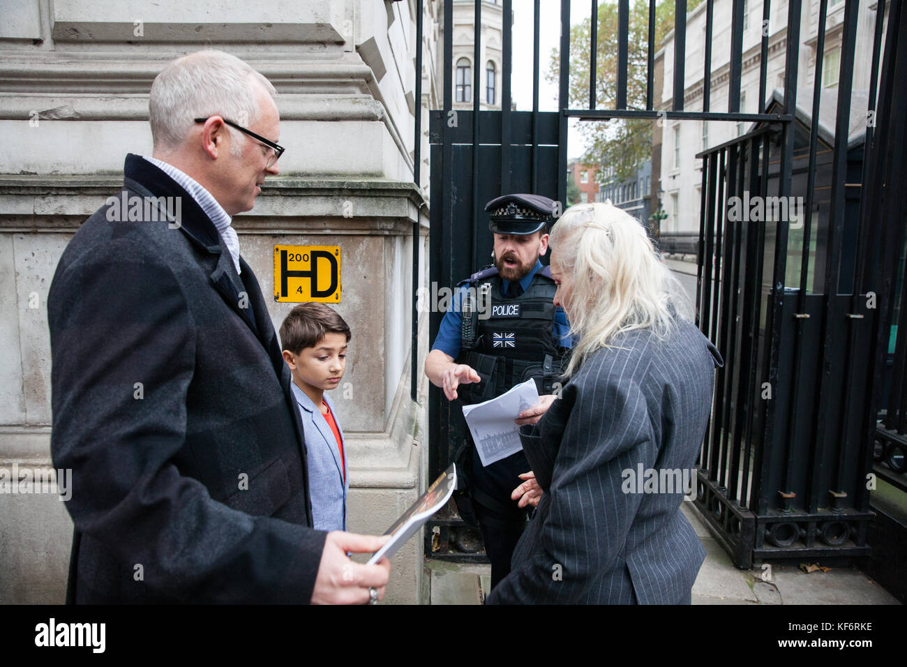 London, UK. 26th Oct, 2017. 9-year-old Oliver Simpson presents at Downing Street with fashion designer Vivienne Westwood and Joseph Corré a second letter he wrote to the Prime Minister expressing his concerns about fracking. They also wished, but were unable, to deliver a photograph of local people from the village of Woodsetts in south Yorkshire with the INEOS logo stuck across their mouths in protest both against legal action taken by the company to deter anti-fracking demonstrators and their plans to drill a shale gas well near to their homes. Credit: Mark Kerrison/Alamy Live News Stock Photo