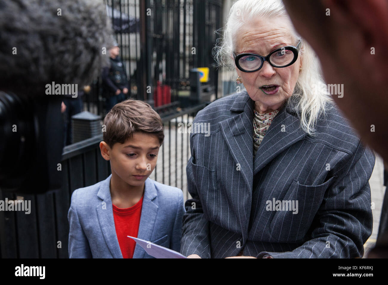 London, UK. 26th Oct, 2017. 9-year-old Oliver Simpson prepares to present at Downing Street with fashion designer Vivienne Westwood a second letter he wrote to the Prime Minister expressing concerns about fracking. They also wished, but were unable, to deliver a photograph of local people from the village of Woodsetts in south Yorkshire with the INEOS logo stuck across their mouths in protest both against legal action taken by the company to deter anti-fracking demonstrators and their plans to drill a shale gas well near to their homes. Credit: Mark Kerrison/Alamy Live News Stock Photo