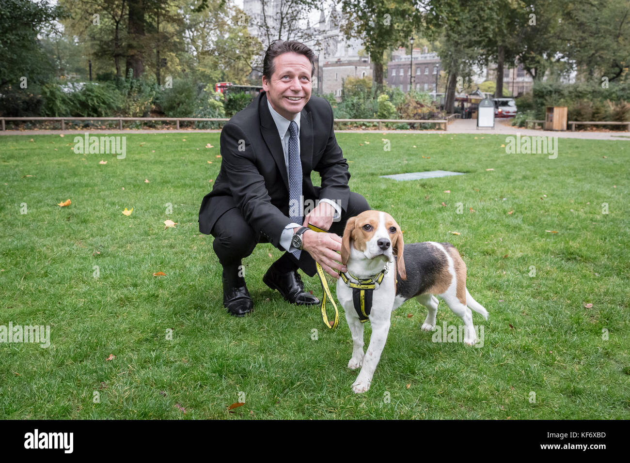 London, UK. 26th Oct, 2017. Nigel Huddleston Conservative MP for Mid Worcestershire constituency pictured with a Dogs Trust dog ‘Bonnie’ at the 25th Annual Westminster Dog of the Year. Credit: Guy Corbishley/Alamy Live News Stock Photo