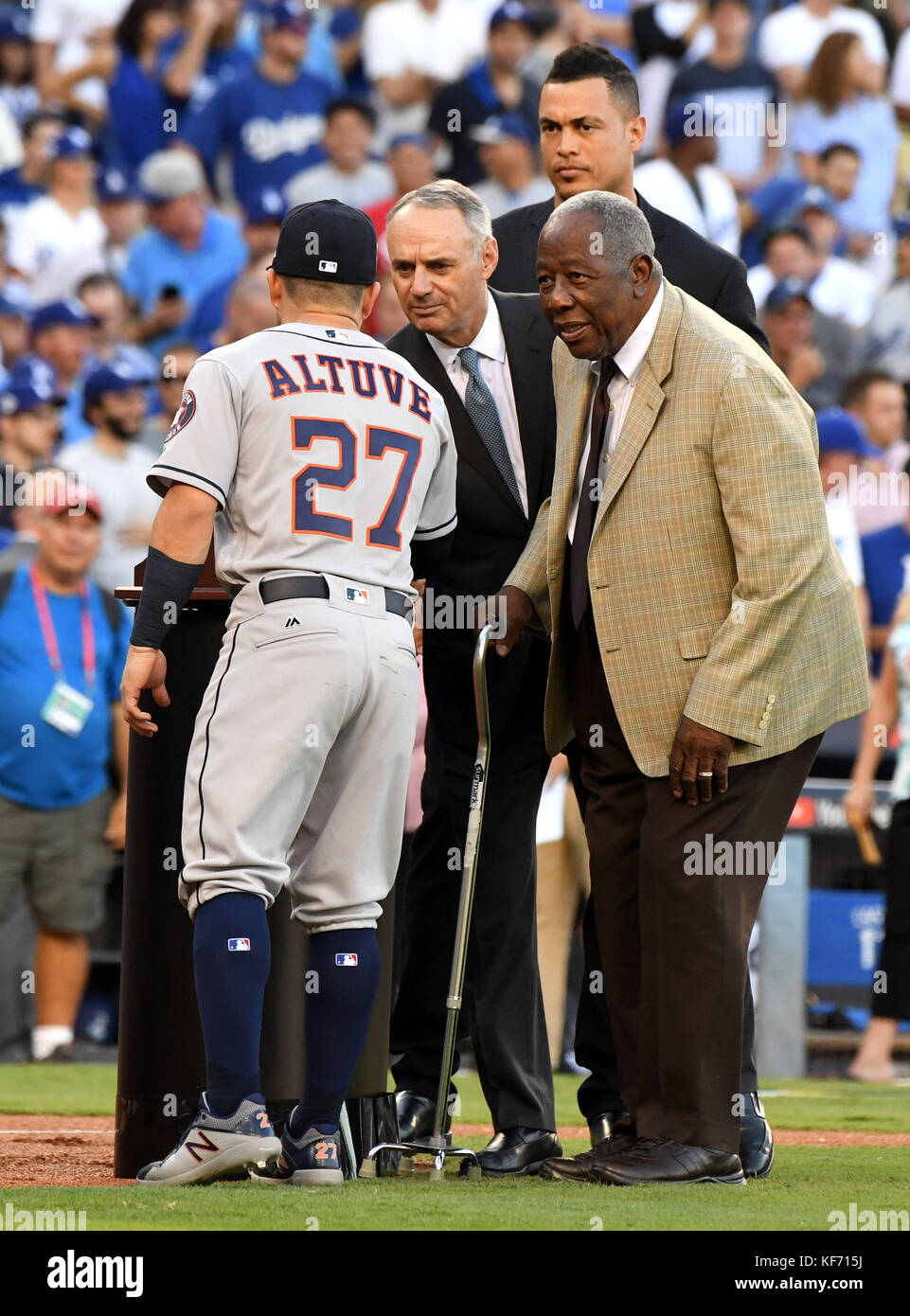 Los Angeles, California, USA. 25th Oct, 2017. Hall of Famer Hank Aaron, right, awards the Hank Aaron Award to Houston Astros' Jose Altuve (27) and Florida Marlins Giancarlo Stanton as Major League Baseball commissioner Rob Manfred looks on prior to game two of a World Series baseball game between the Houston Astros and the Los Angeles Dodgers at Dodger Stadium on Wednesday, Oct. 25, 2017 in Los Angeles. (Photo by Keith Birmingham, Pasadena Star-News/SCNG) Credit: San Gabriel Valley Tribune/ZUMA Wire/Alamy Live News Stock Photo