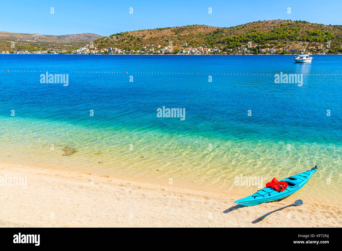 Blue kayak on beautiful beach in Rogoznica town, Dalmatia, Croatia Stock Photo